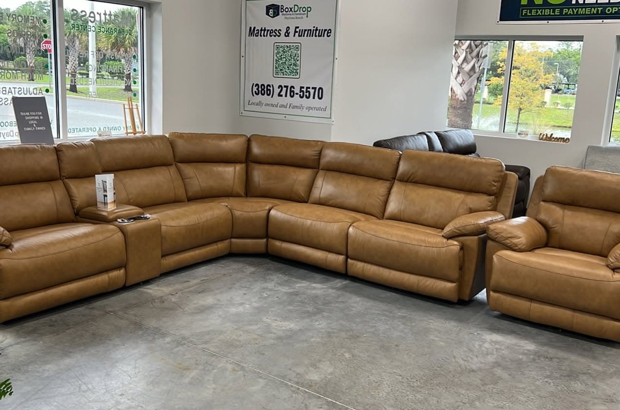 Tan Leather Power Sectional, In stock now at the BoxDrop Daytona Beach showroom on Fentress Blvd