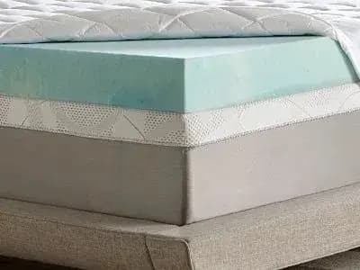 Hand pressing a foam mattress at BoxDrop Daytona Beach in Daytona Beach, FL