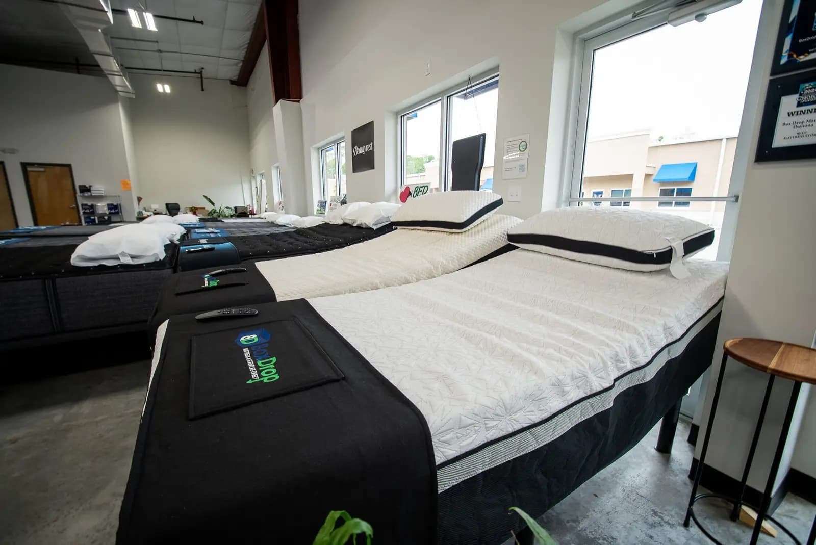 A white quilted mattress on the floor at BoxDrop Daytona Beach